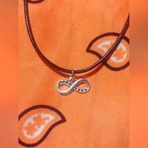 Black cord necklace with infinity charm